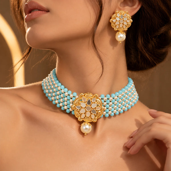 Close-up of the Jwanas Aria Turquoise Pearl Beaded Choker and matching earring worn on the neck and ear
