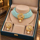 Jwanas Aria Turquoise Pearl Beaded Choker Set displayed inside an open jewellery box with matching earrings
