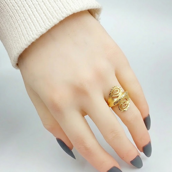 Close-up of Jwanas Astra Filigree Bypass Ring worn on hand