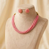 Blush Pink multi-strand beaded necklace displayed on mannequin.