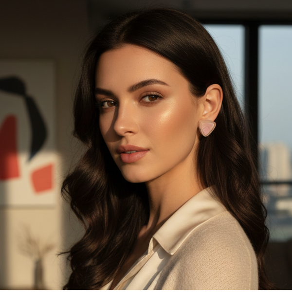 Model wearing Jwanas Blush Pink Triangle Stud Earrings