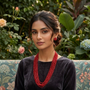 Model wearing Crimson Royale Multi-Layer Beaded Necklace Set with earrings