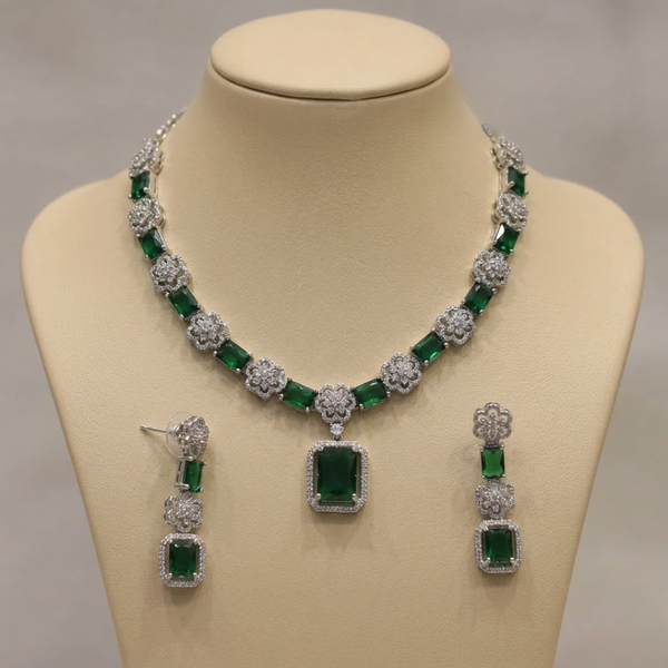 Jwanas Emerald-Bloom Floral Necklace Set with earrings displayed on mannequin