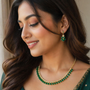 Model wearing Emerald Elegance Gold Necklace and Earring Set