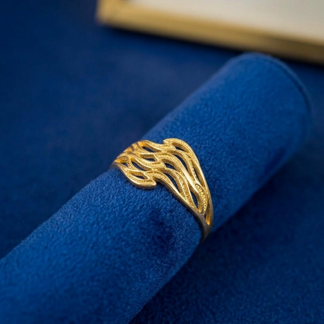 Jwanas Ethereal Wave Filigree Ring displayed as a flat lay on blue fabric