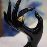 Jwanas Ethereal Wave Filigree Ring displayed on a black hand mannequin
