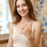 Model wearing the Jwanas Ethereal Wave Filigree Ring, smiling with hand raised near shoulder
