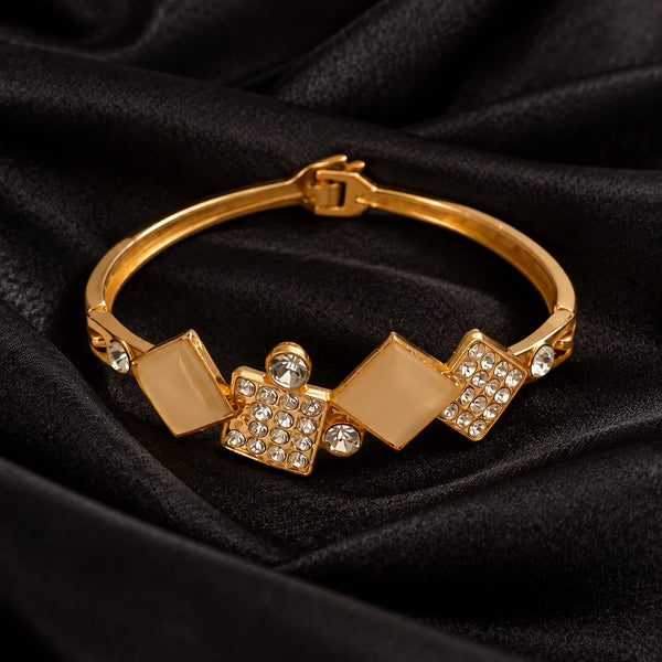 Jwanas Geometric Diamond Crystal Bangle on black satin fabric