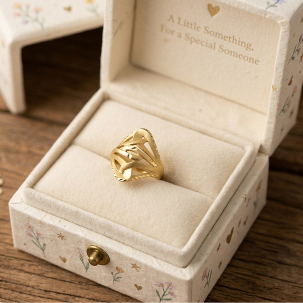 Jwanas Gilded Lattice Statement Ring shown inside an open jewellery box