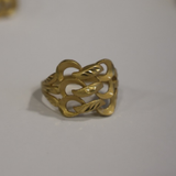 Jwanas Gilded Petal Filigree Ring close-up on grey background