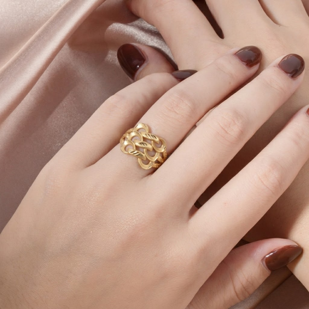 Close-up of Jwanas Gilded Petal Filigree Ring worn on hand