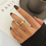 Close-up of Jwanas Gilded Swirl Cocktail Ring worn on hand
