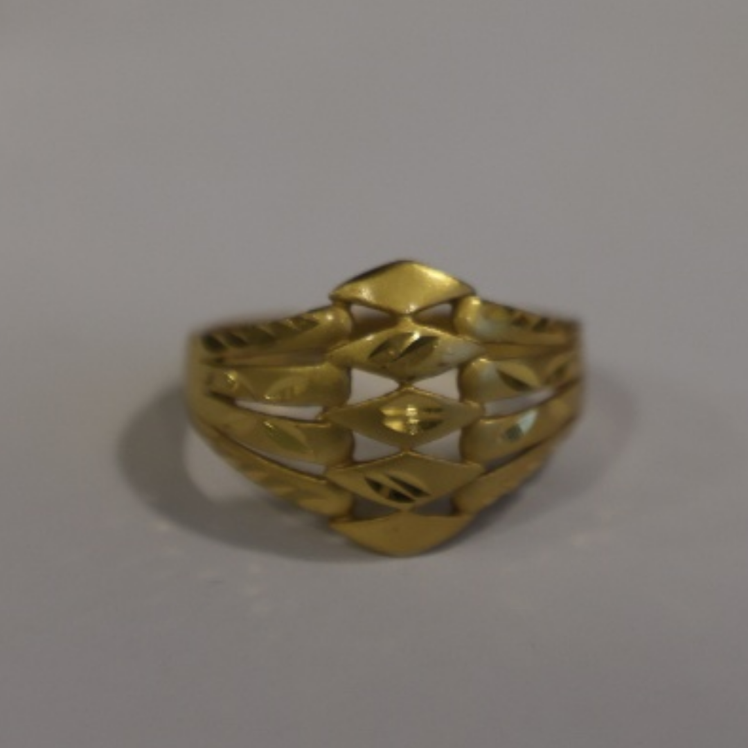 Jwanas Gilded Swirl Filigree Ring close-up on grey background