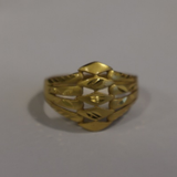 Jwanas Gilded Swirl Filigree Ring close-up on grey background