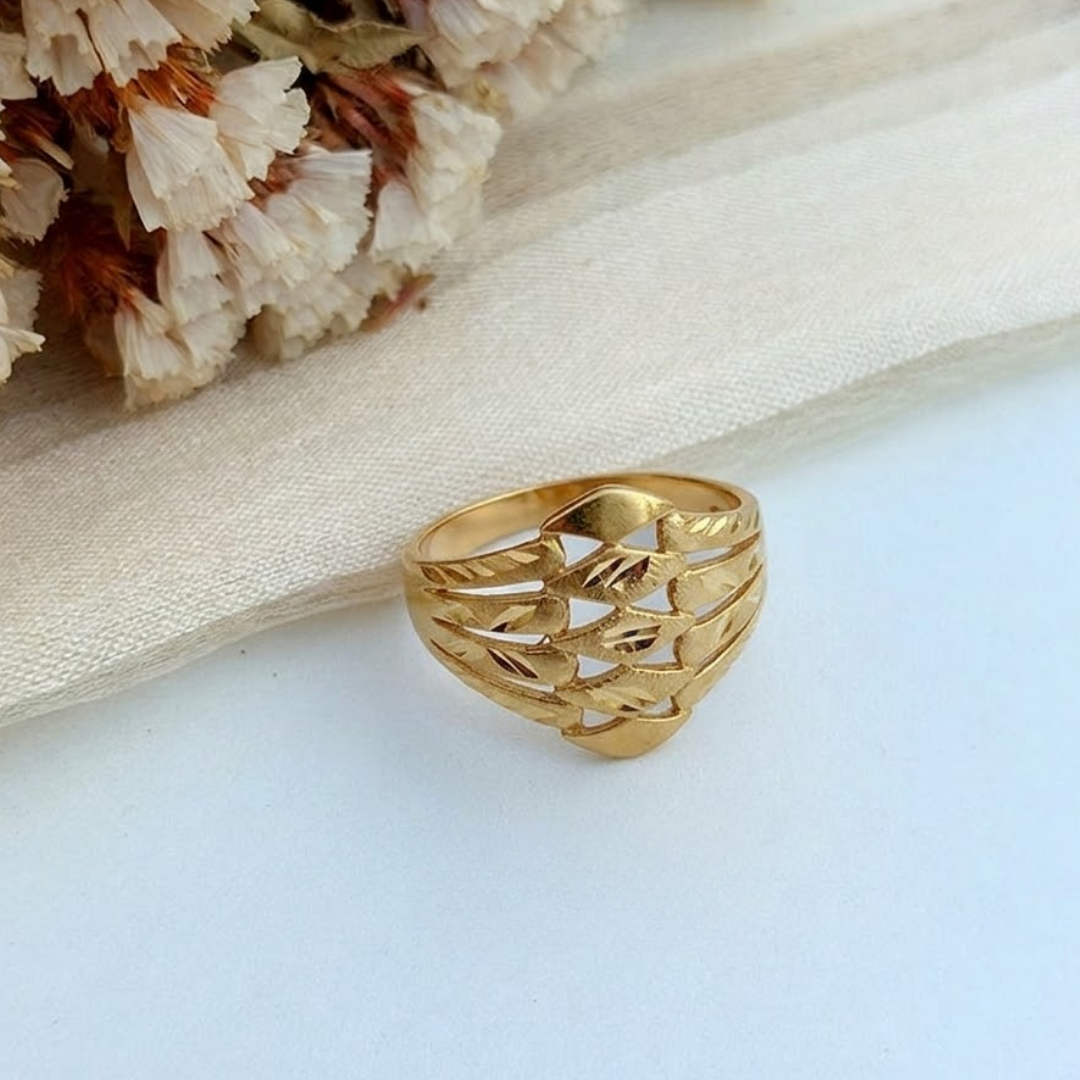 Jwanas Gilded Swirl Filigree Ring flat lay on light fabric