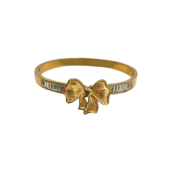 Jwanas Golden Bow Baguette Bangle Bracelet shown against a plain white background