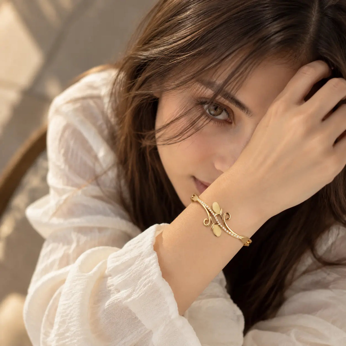 Model wearing Jwanas Golden Vine Leaf Crystal Bangle Bracelet