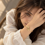 Model wearing Jwanas Golden Vine Leaf Crystal Bangle Bracelet