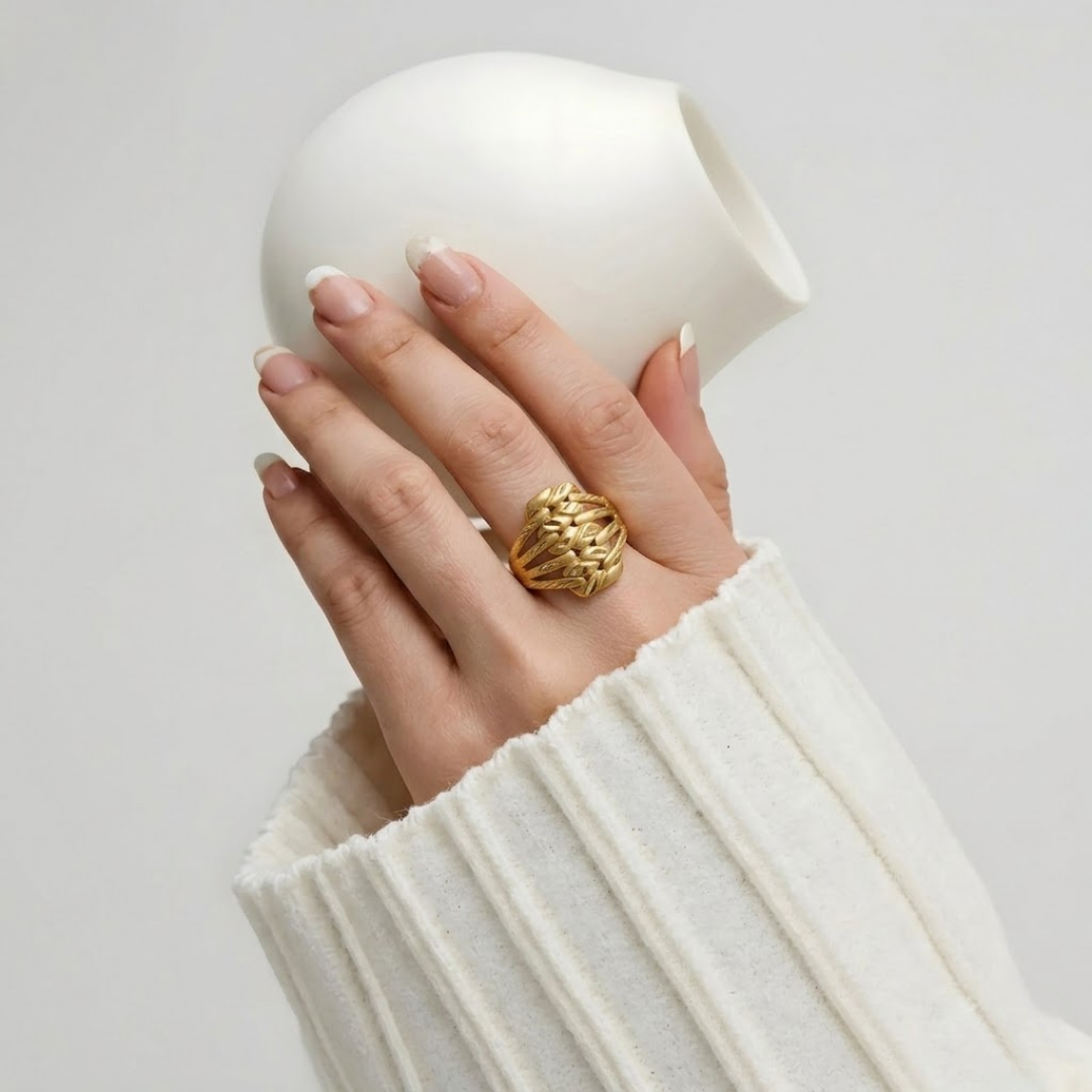 Close-up of Jwanas Harvest Grain Textured Ring worn on hand