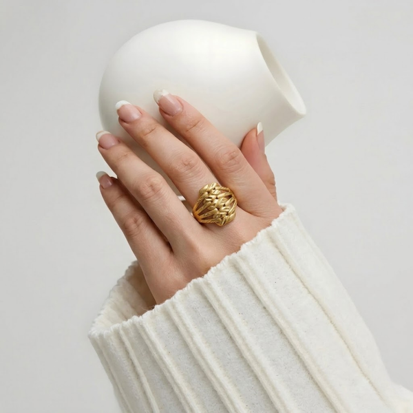 Close-up of Jwanas Harvest Grain Textured Ring worn on hand