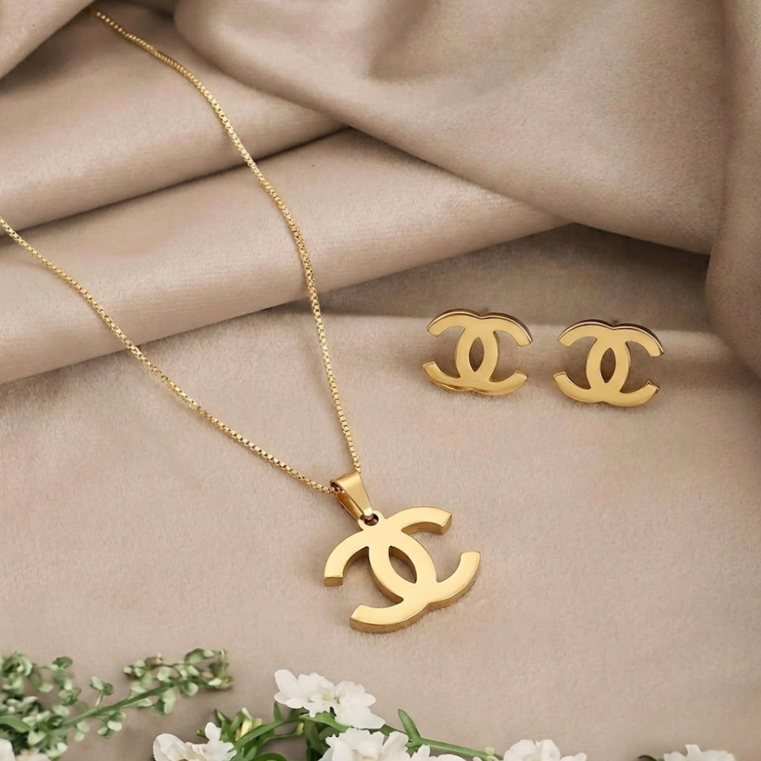 Jwanas Iconic Interlocking Pendant and Stud Set flat lay