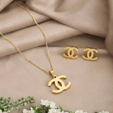 Jwanas Iconic Interlocking Pendant and Stud Set flat lay