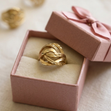 Jwanas Infinite Knot Ring displayed in jewellery box packaging