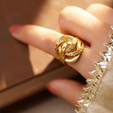 Close-up of Jwanas Infinite Knot Ring worn on hand