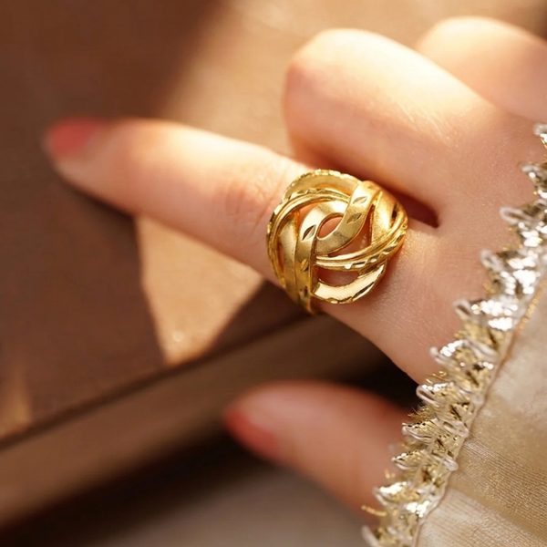 Close-up of Jwanas Infinite Knot Ring worn on hand