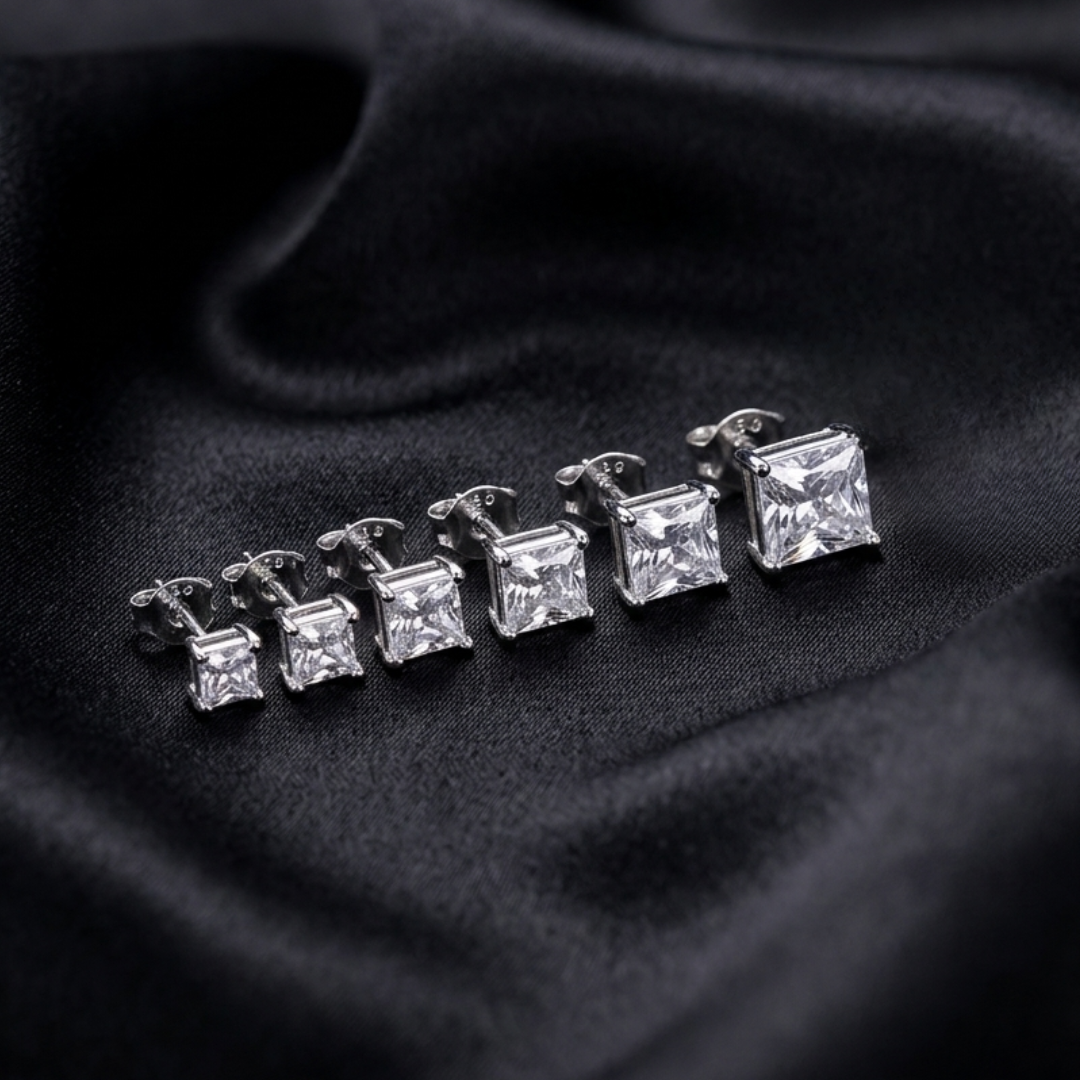 Jwanas Lucent graduated Princess-Cut stud earring set flat lay