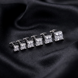 Jwanas Lucent graduated Princess-Cut stud earring set flat lay