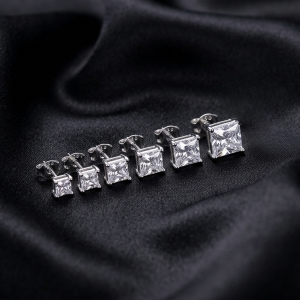 Jwanas Lucent graduated Princess-Cut stud earring set flat lay