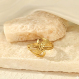 Jwanas Luna Petal Ring flat lay on light fabric