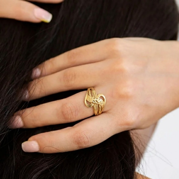 Close-up of Jwanas Luna Petal Ring worn on hand