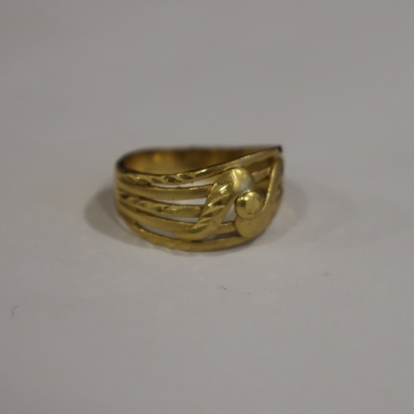 Jwanas Lyra Textured Band Ring
close-up on grey background