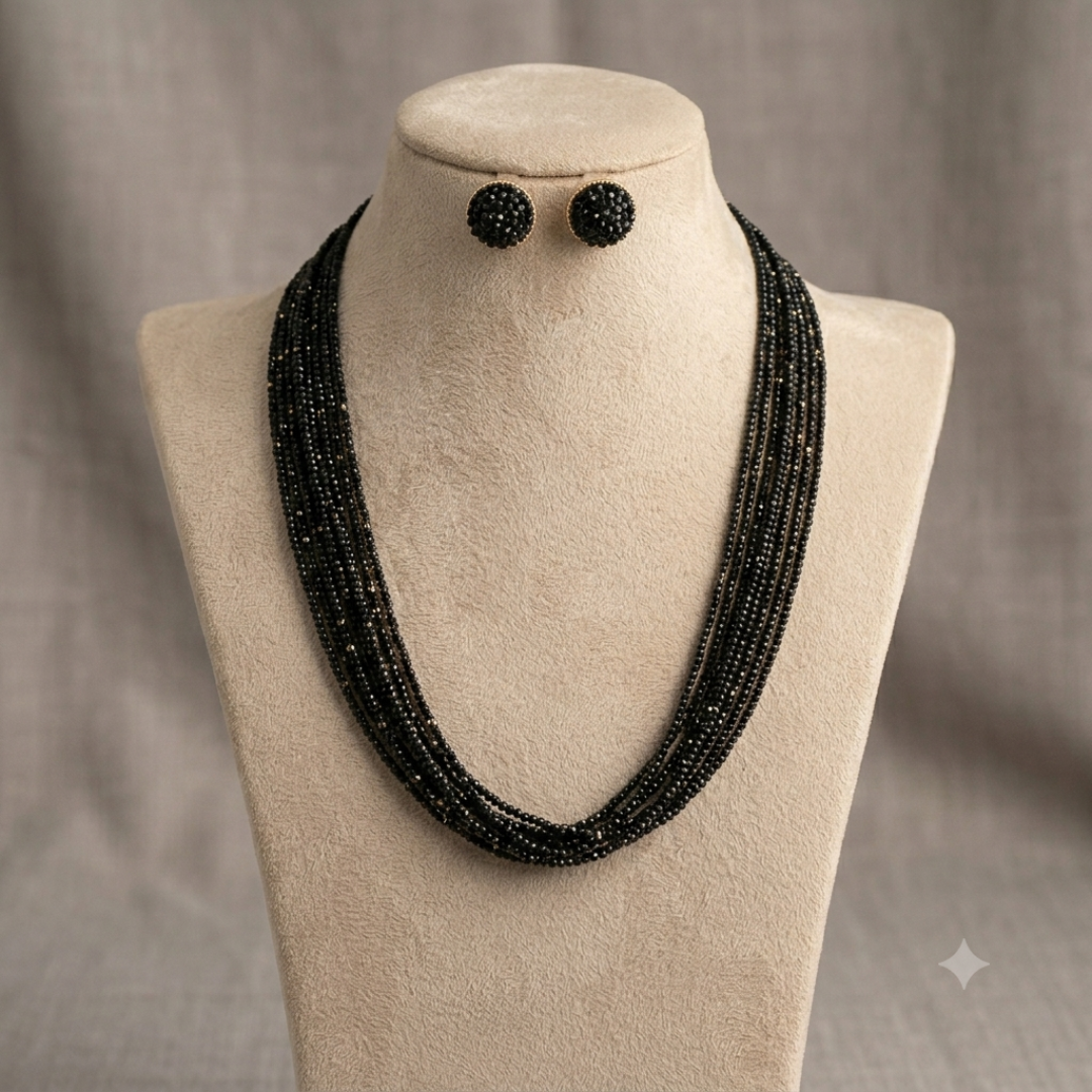 Midnight Elegance black beaded necklace and earring set displayed on mannequin.