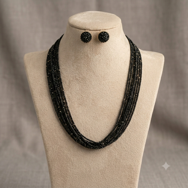 Midnight Elegance black beaded necklace and earring set displayed on mannequin.
