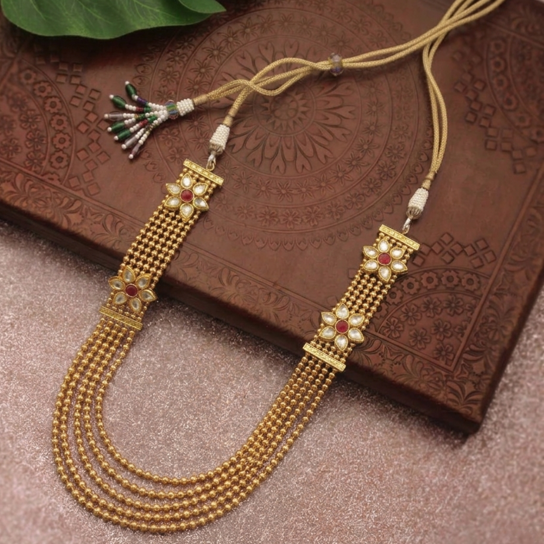 Jwanas Noor Multi-Layered Kundan Mala flat lay on fabric