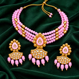 Jwanas Pink Blossom Beaded Choker Set displayed as a flat lay on dark green velvet with matching earrings