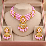 Jwanas Pink Blossom Beaded Choker Set displayed inside an open pink jewellery box with matching earrings