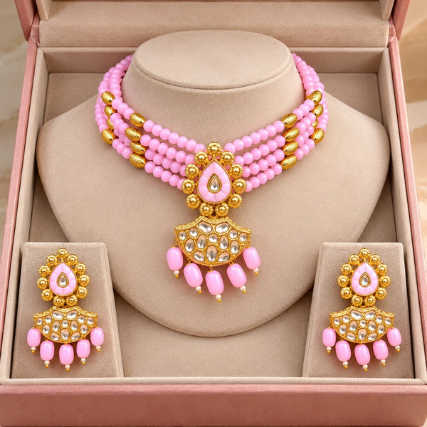 Jwanas Pink Blossom Beaded Choker Set displayed inside an open pink jewellery box with matching earrings