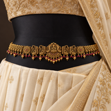 Jwanas Royal Lakshmi Temple Gold Kamarbandh styled over an ivory saree with intricate gold embroidery.