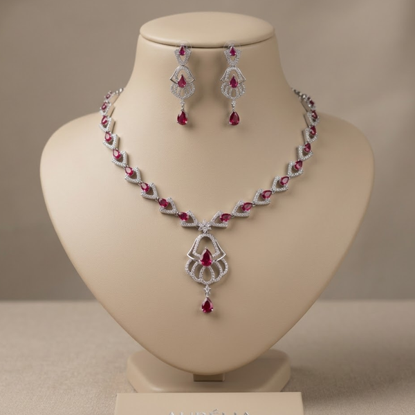 Jwanas Ruby-Inspired Teardrop Necklace Set with earrings displayed on mannequin