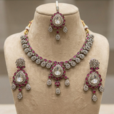 Jwanas Ruby-Toned Crystal necklace and earrings displayed on mannequin