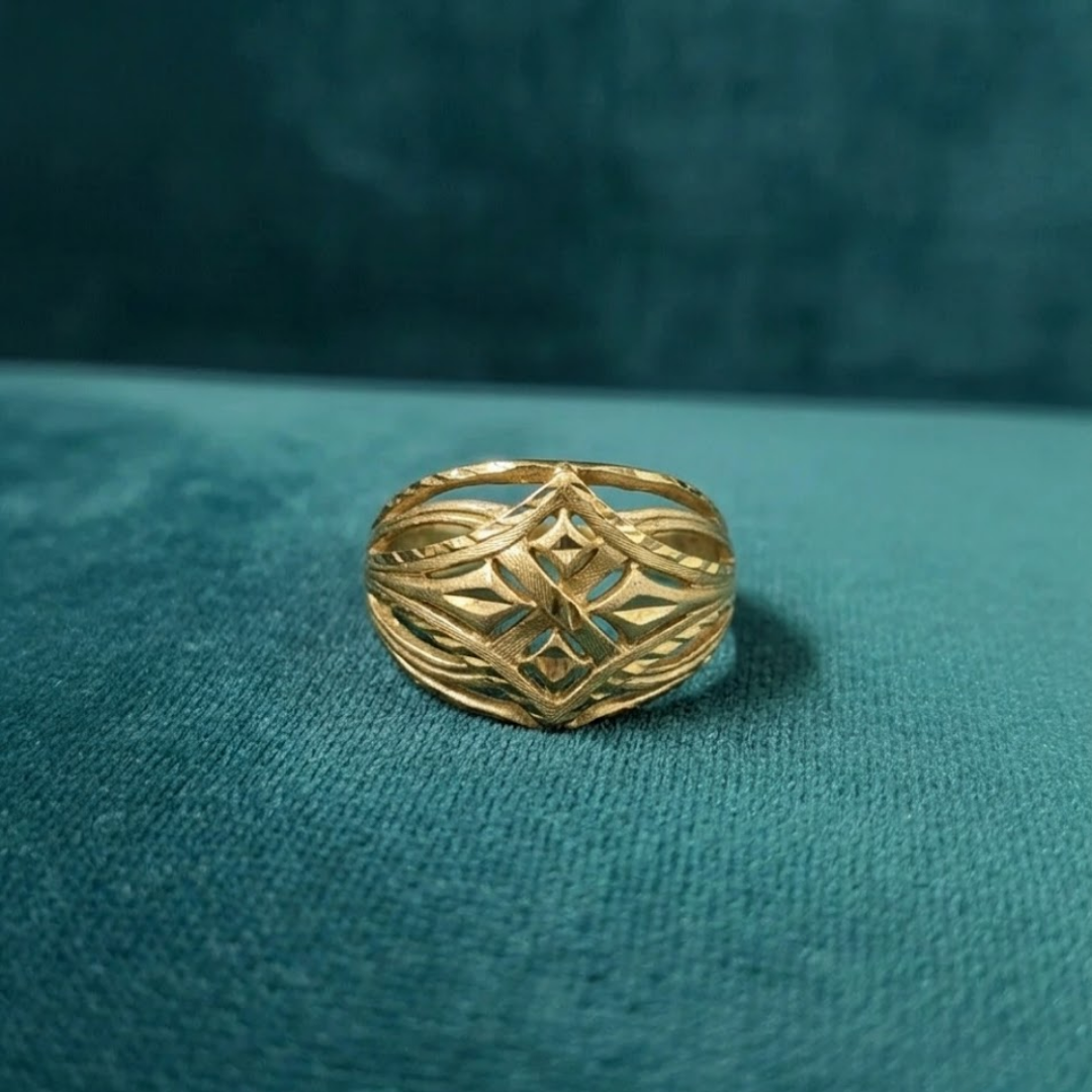 Jwanas Solara Filigree Ring flat lay on green background