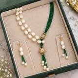 Jwanas Verdant Pearl Cascade Necklace Set displayed inside an open green jewellery box with matching earrings