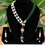 Jwanas Verdant Pearl Cascade Necklace Set displayed on a black bust stand with matching earrings